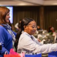 person selecting prize bag